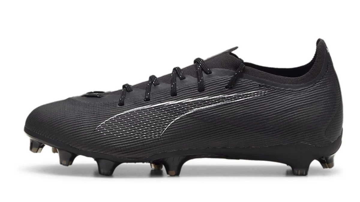 Puma Ultra Pro Firm Ground Football Boots in Black. Featured as part of the Puma Eclipse 2024 Pack. Available to purchase at Lovellsoccer.co.uk