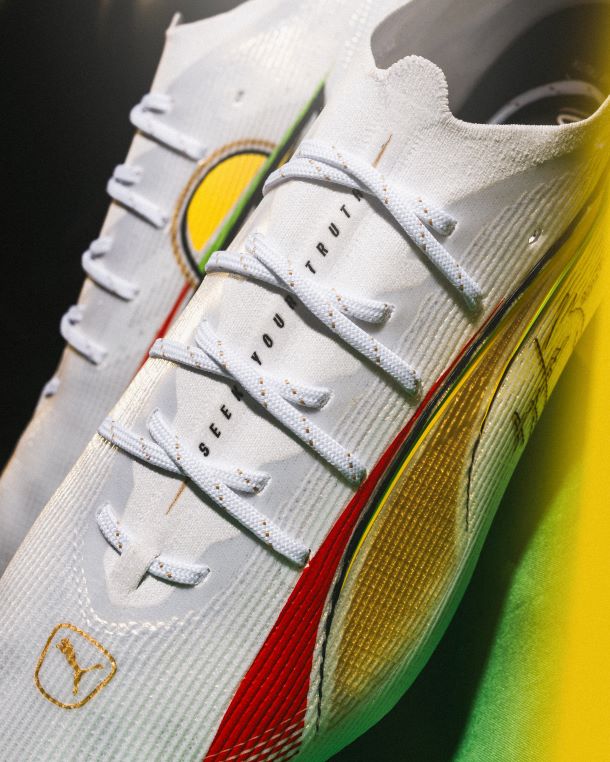 Close up of the Puma x Senna Ultra 5 football boot, with message "See Your Truth" presented in black on a white upper.